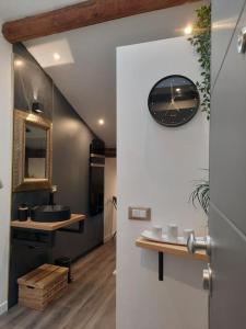 a bathroom with a sink and a mirror on the wall at Luxury Room La Terrazza sul Lago di Como in Blevio