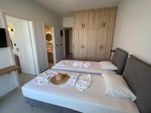 Posteľ alebo postele v izbe v ubytovaní Hotel Kathrin Beach