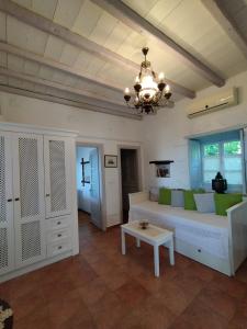 a living room with a couch and a table at Patmos Chora traditional villa Genadio in Patmos