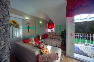 a living room with a couch and a window at Villa Barbara in Skradin