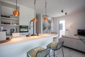 TV a/nebo společenská místnost v ubytování Blue Bay Reef apartment 19