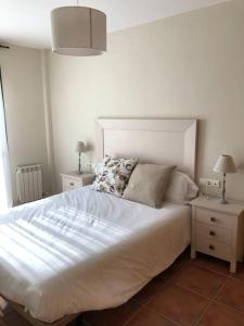 Postel nebo postele na pokoji v ubytování Casa Picual, Mancha Real, Jaén