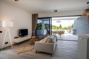 TV a/nebo společenská místnost v ubytování Blue Bay Reef apartment 19