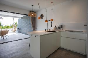 Kuchyň nebo kuchyňský kout v ubytování Blue Bay Reef apartment 19