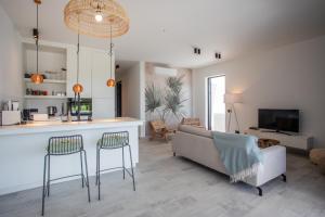 TV a/nebo společenská místnost v ubytování Blue Bay Reef apartment 19