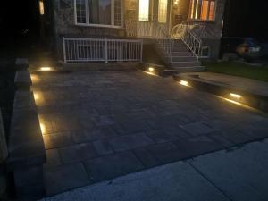a patio with lights in front of a house at QUIET Appartment near Montreal CITQ 3O9764 in Longueuil
