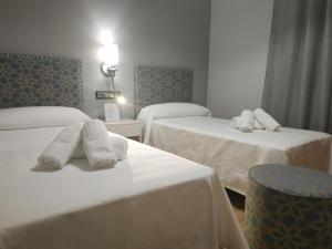 A bed or beds in a room at La Olma
