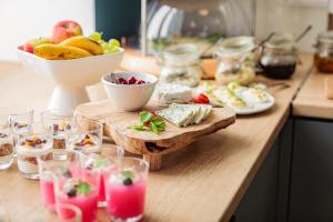 a table with food and a bowl of fruit at Hotel Traffic Wrocław Stare Miasto in Wrocław