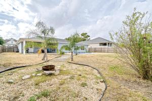 a yard with a house in the background at Lagoon Retreat in Pensacola