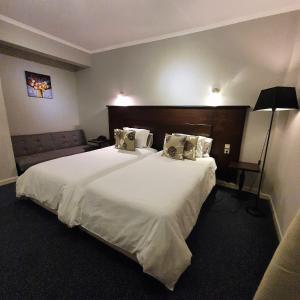 A bed or beds in a room at Liknon