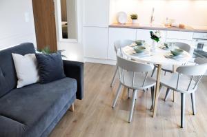 a living room with a table and a couch at Old Town Walowa in Gdańsk