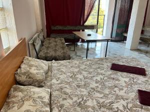 Ένα ή περισσότερα κρεβάτια σε δωμάτιο στο Smile Guesthouse