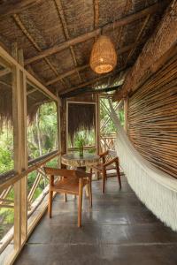 Balkón nebo terasa v ubytování Yaxchen Tulum Cabañas & Cenote