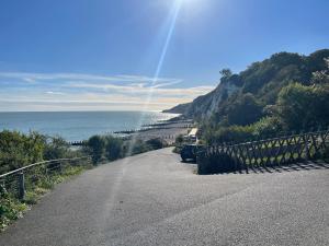 an empty road with a view of the ocean at Impeccable 2-Bed Apartment in Eastbourne in Eastbourne