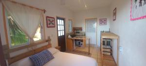 a bedroom with a bed and a fireplace in it at Casa Gio in Puerto Escondido