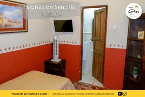 a room with a room with a bed and a bathroom at Posada de San Carlos La Quinta in Antigua Guatemala
