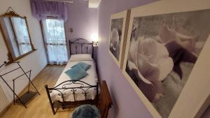 Posteľ alebo postele v izbe v ubytovaní Le Rondini di Casa Bernardi, sole e natura sulle Dolomiti Wi-Fi PetFriendly