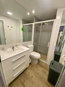 a bathroom with a sink and a toilet and a shower at LOFT vistas playa jardin in Puerto de la Cruz