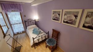 Posteľ alebo postele v izbe v ubytovaní Le Rondini di Casa Bernardi, sole e natura sulle Dolomiti Wi-Fi PetFriendly