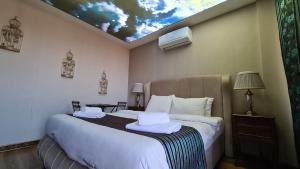 Postel nebo postele na pokoji v ubytování Mavisu Deluxe Butik Otel