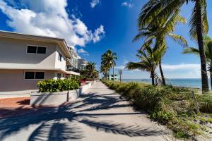 a house on the beach with palm trees at The Desoto - Oceanview Inn in Hollywood +64 photos