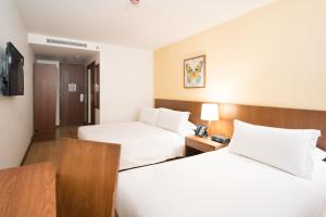 Hotel Habitel Select客房内的一张或多张床位