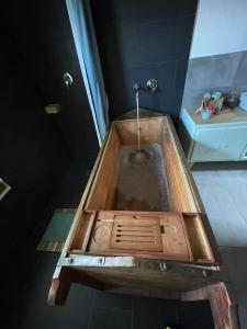 a bath tub with a sink in a bathroom at B&B The Wine Room - Az. Agr. Matunei in Cardona