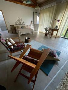 a living room with a couch and a table at B&B The Wine Room - Az. Agr. Matunei in Cardona