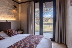 Voodi või voodid majutusasutuse Chilcabamba Lodge toas