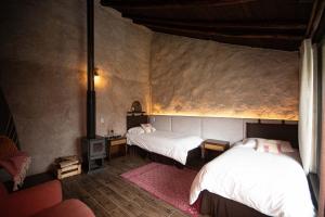 Voodi või voodid majutusasutuse Chilcabamba Lodge toas
