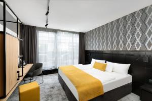 Posteľ alebo postele v izbe v ubytovaní Art Hotel Szeged