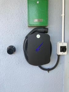 a computer mouse and a cord hanging on a wall at Estuary View Apartment in Kilrush