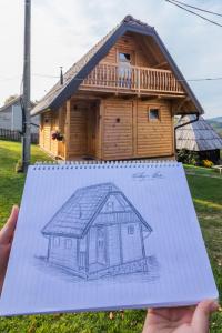 un disegno di una casa di Brvnara Oganj a Čajetina