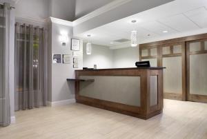 a waiting room with a reception counter in a hospital at Trellis Lake Pointe in Charlotte