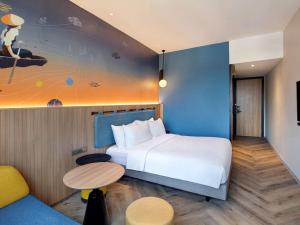Krevet ili kreveti u jedinici u objektu ibis Styles Semarang Simpang Lima