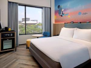 Krevet ili kreveti u jedinici u objektu ibis Styles Semarang Simpang Lima