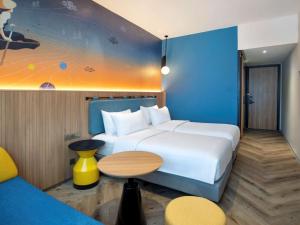 Krevet ili kreveti u jedinici u objektu ibis Styles Semarang Simpang Lima