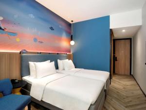 Krevet ili kreveti u jedinici u objektu ibis Styles Semarang Simpang Lima