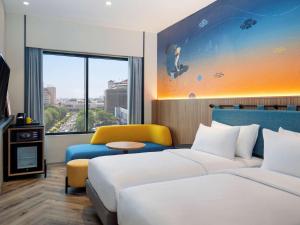 Krevet ili kreveti u jedinici u objektu ibis Styles Semarang Simpang Lima
