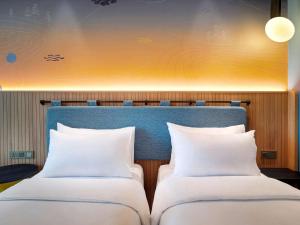 Krevet ili kreveti u jedinici u objektu ibis Styles Semarang Simpang Lima