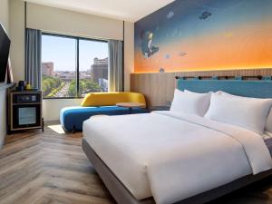 Krevet ili kreveti u jedinici u objektu ibis Styles Semarang Simpang Lima