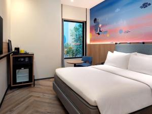 Krevet ili kreveti u jedinici u objektu ibis Styles Semarang Simpang Lima