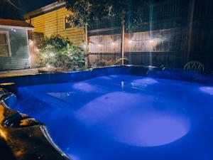 a blue hot tub in a backyard at night at B&B Zia Gianna in Savannah