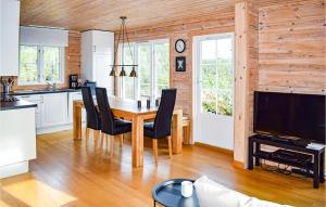 a kitchen and dining room with a table and chairs at Amazing Home In Kongsberg With House A Panoramic View in Kongsberg