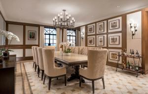 a dining room with a table and chairs at The Manila Hotel in Manila