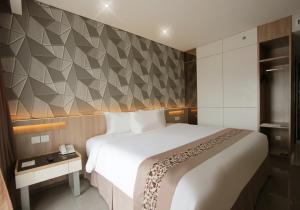 En eller flere senger på et rom på Sala View Hotel