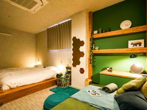 Una cama o camas en una habitación de Mange Tak Resort Onomichi