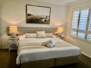 Llit o llits en una habitació de Riverdance Apartments