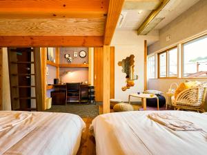 Una cama o camas en una habitación de Mange Tak Resort Onomichi