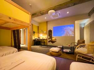 Una cama o camas en una habitación de Mange Tak Resort Onomichi